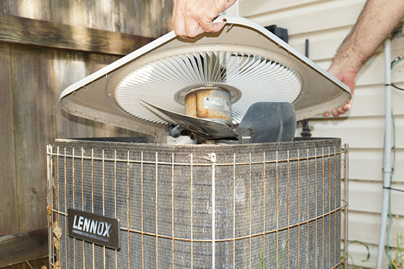 Removing and inspecting air conditioning condenser fan assembly