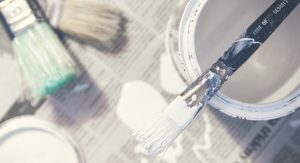 Paint and brushes for interior house painting DIY project