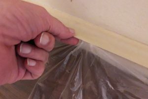 DIY accent wall drop cloth tip with tape