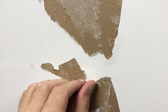 Torn drywall paper repair
