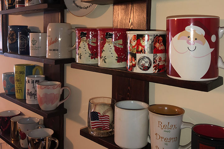 DIY wall mounted shelving unit to display a coffee mug collection