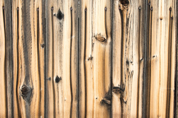 Screws bleeding on planks of wooden fence