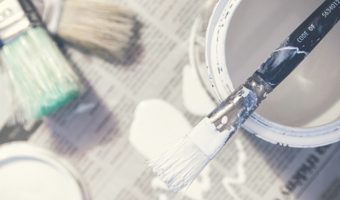 Paint and brushes for interior house painting DIY project