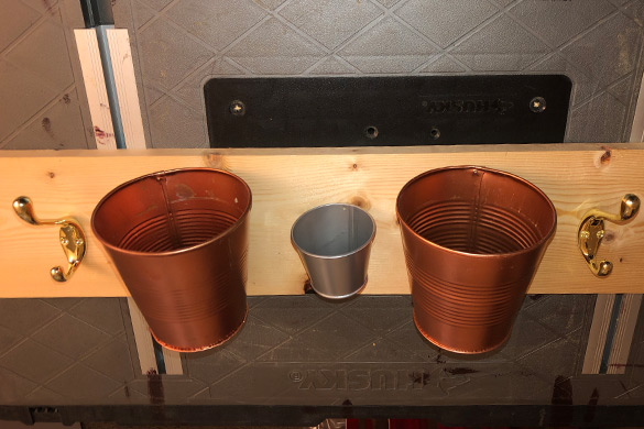 Storage tins and hooks for a DIY wall mounted coat rack