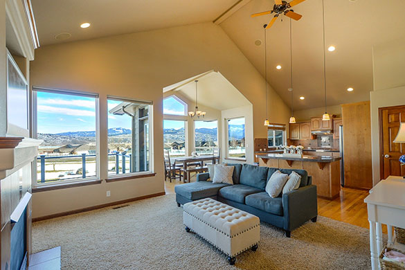 Living room architecture and design with large windows and vaulted ceiling